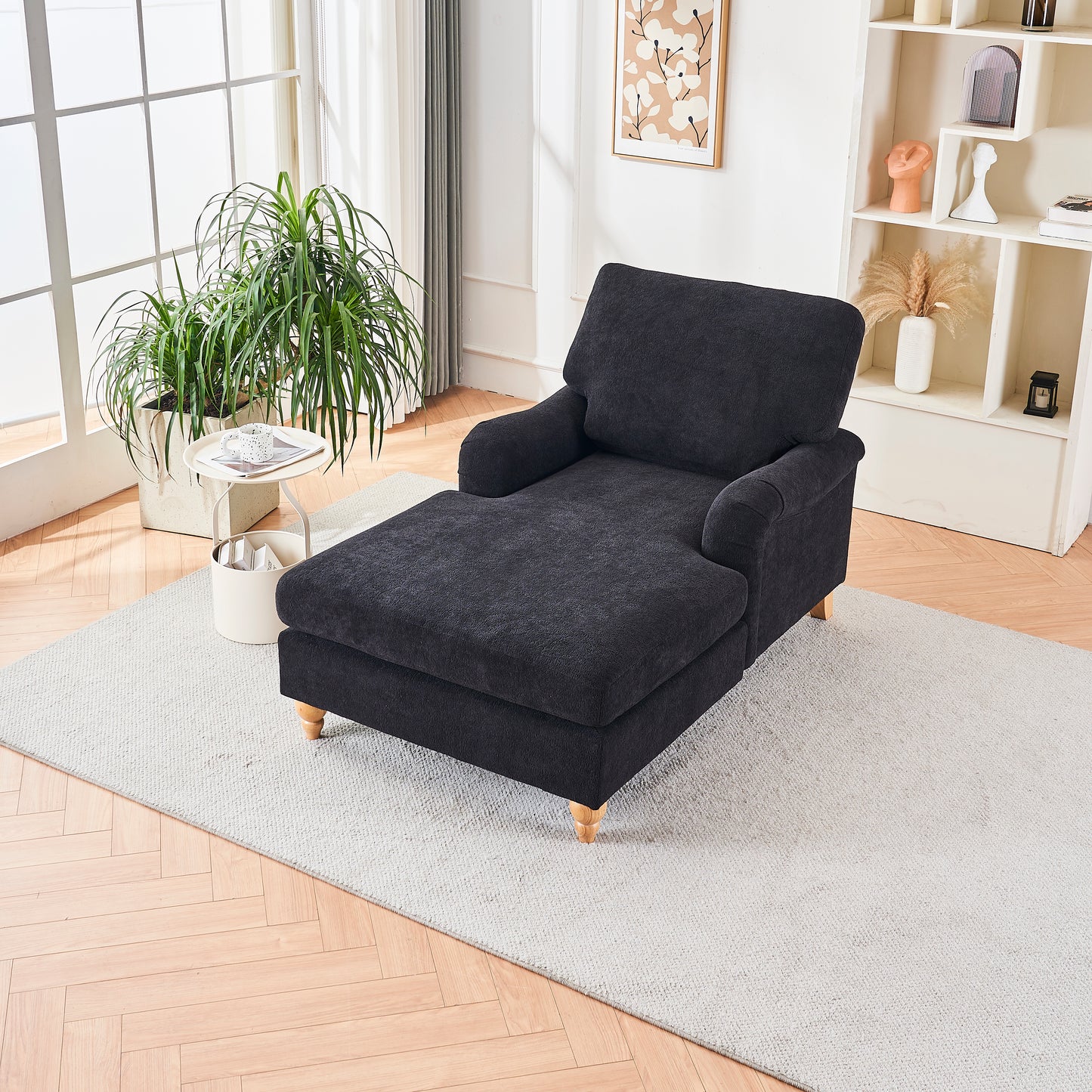 Dark gray fabric chaise lounge with plush upholstery and wooden legs perfect for living rooms