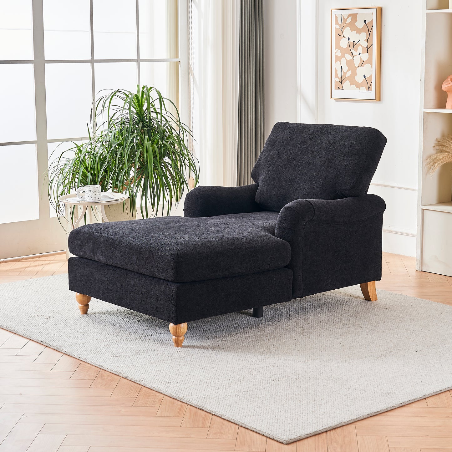 Dark gray fabric chaise lounge with tufted cushion and wooden legs