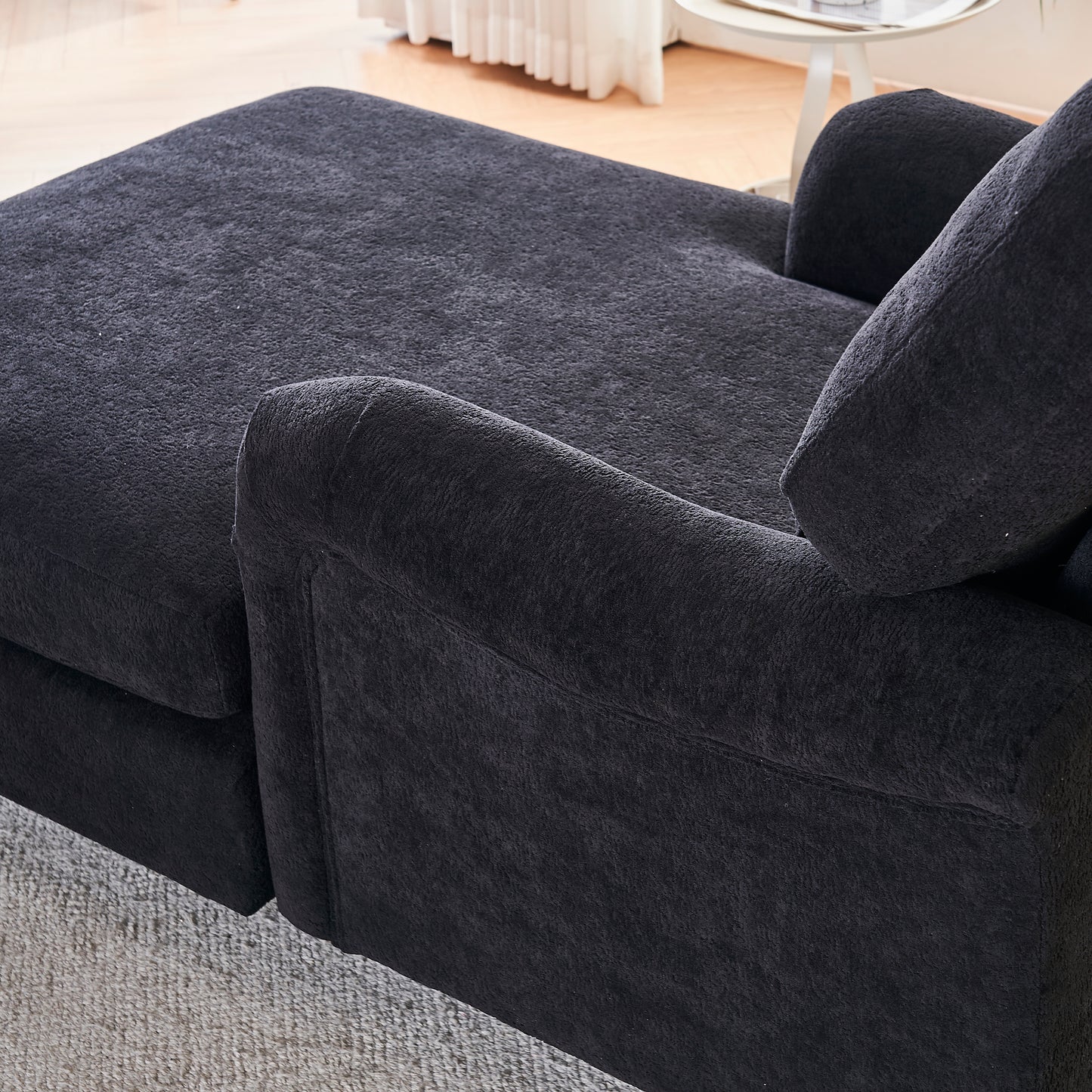 Plush dark grey fabric chaise lounge detail
