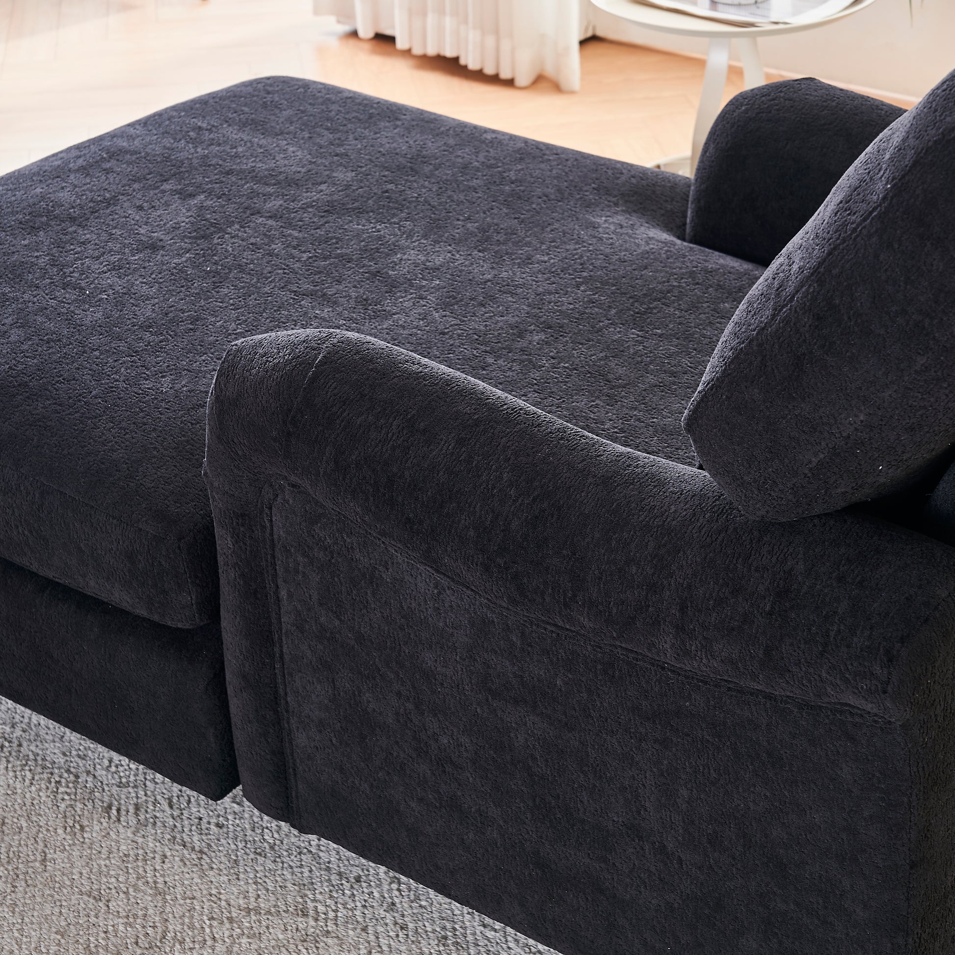 Plush dark grey fabric chaise lounge detail