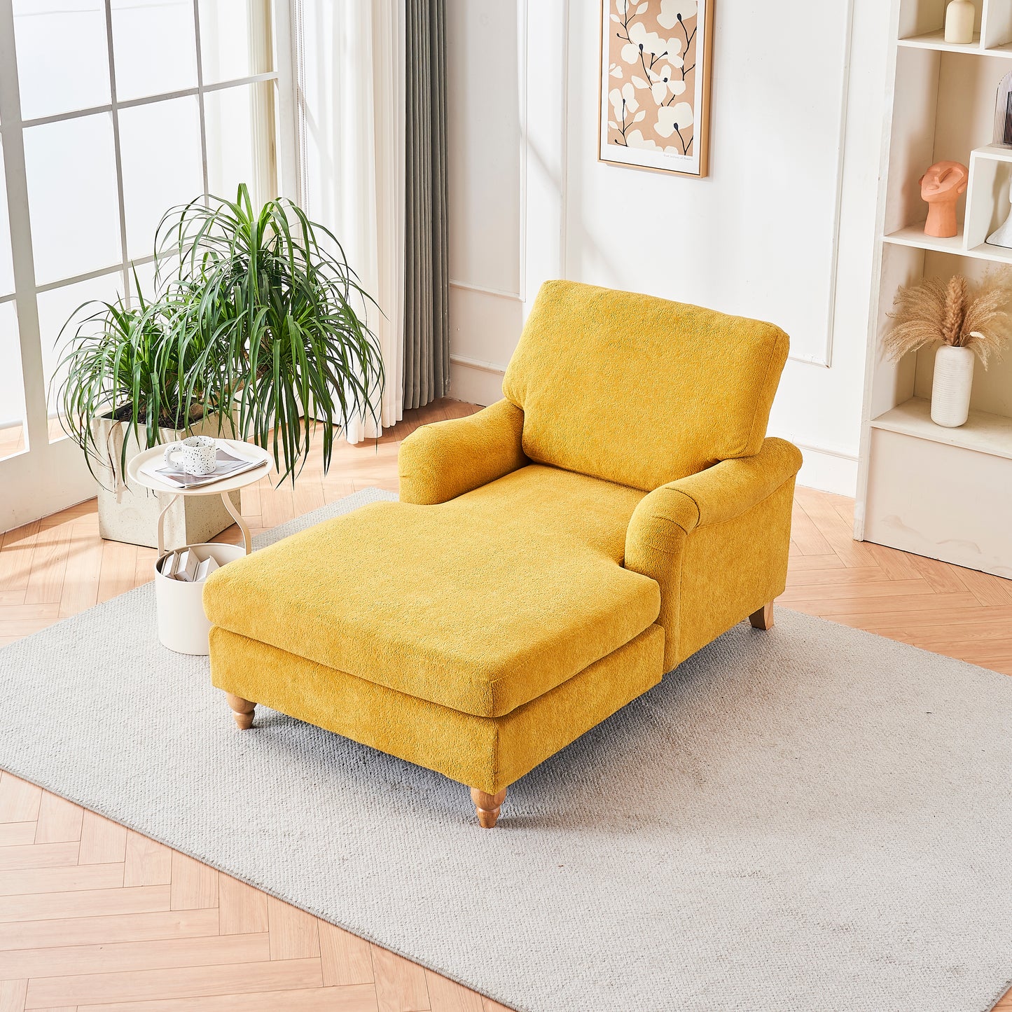 Yellow fabric chaise lounge with wooden legs on a grey rug