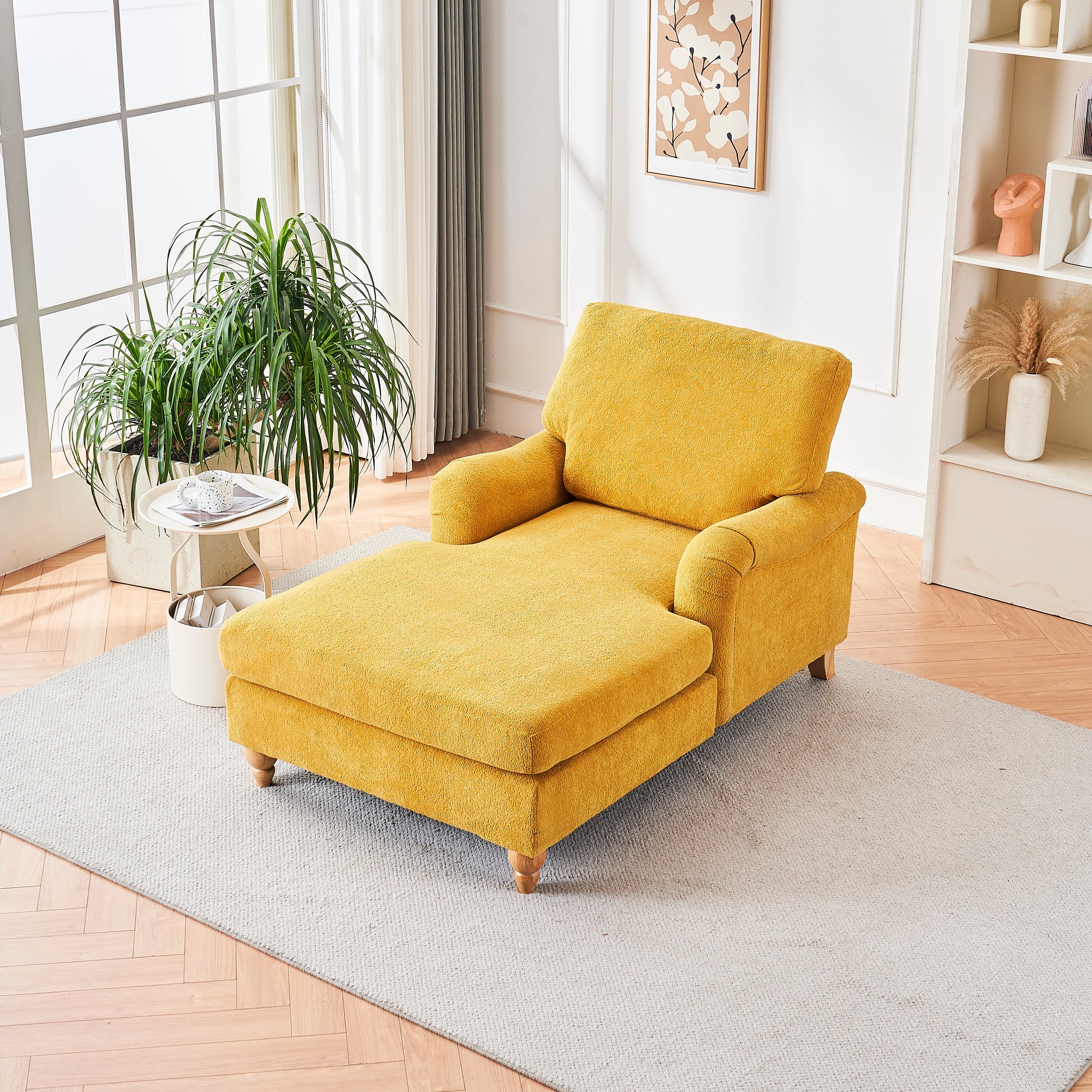 Yellow fabric chaise lounge with wooden legs on a grey rug