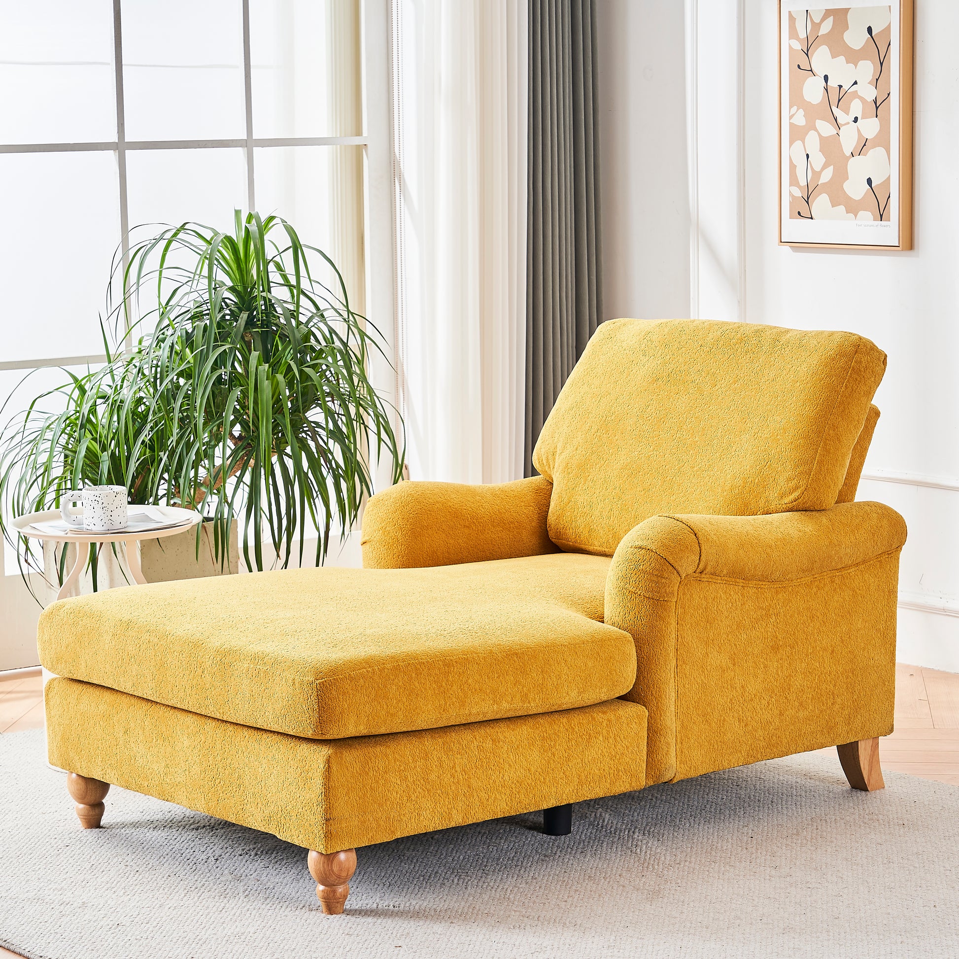 Yellow fabric chaise lounge with plush cushions and wooden legs