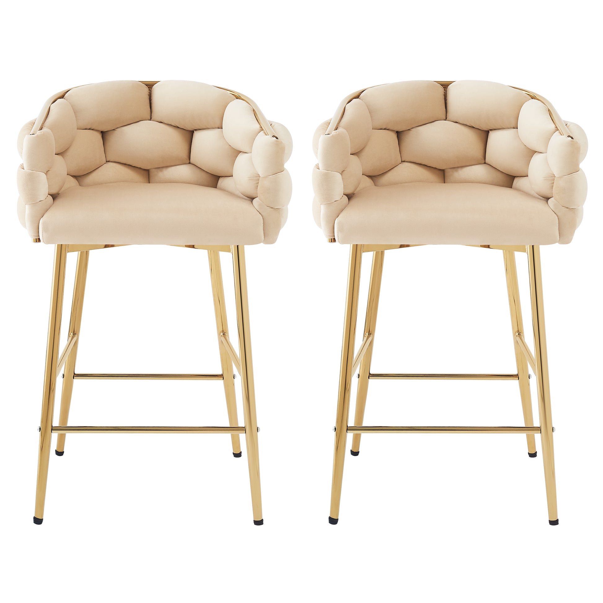 Two plush champagne velvet bar stools with gold metal legs featuring a buttontufted design for a modern living space