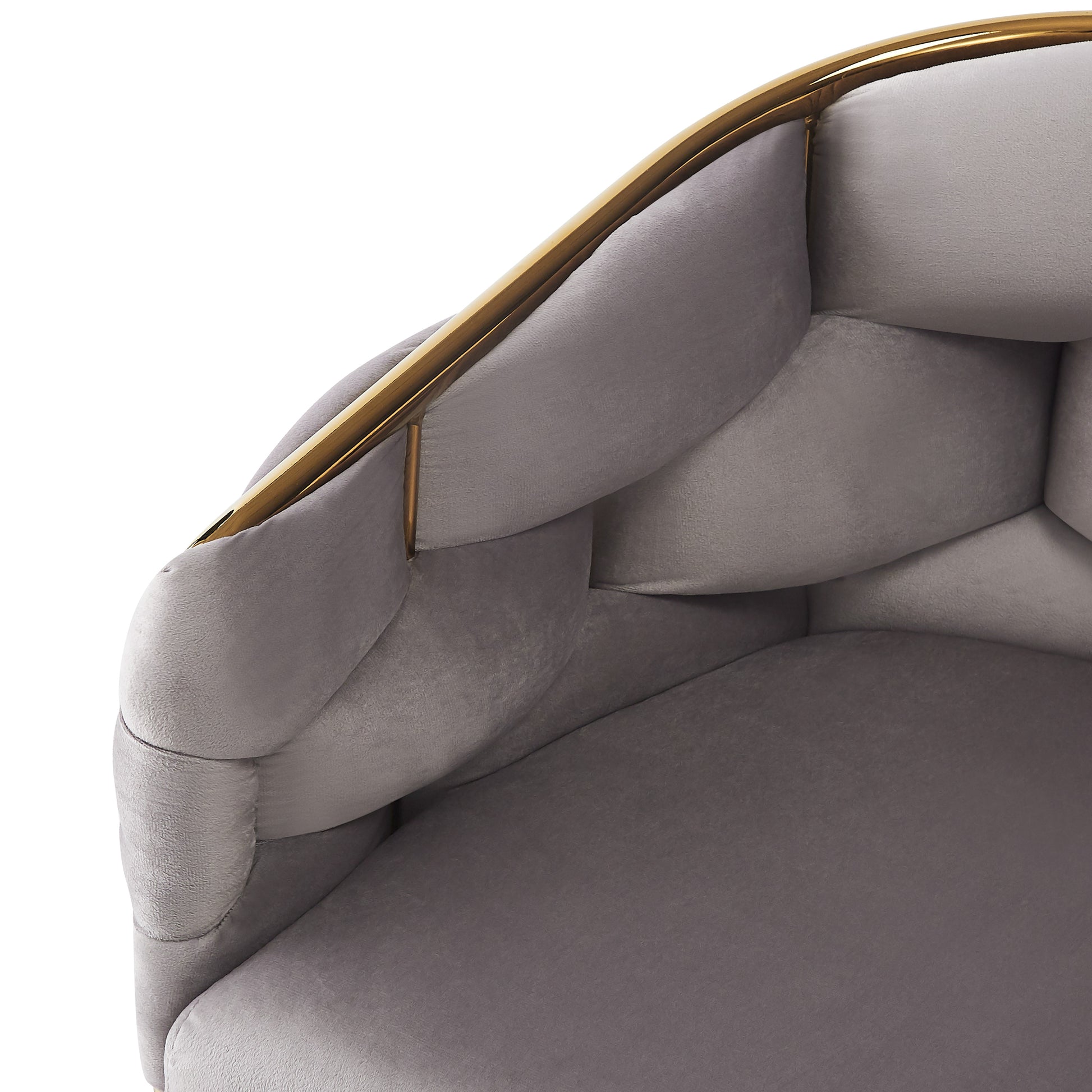 Grey velvet accent chair with gold metal frame and tufted back