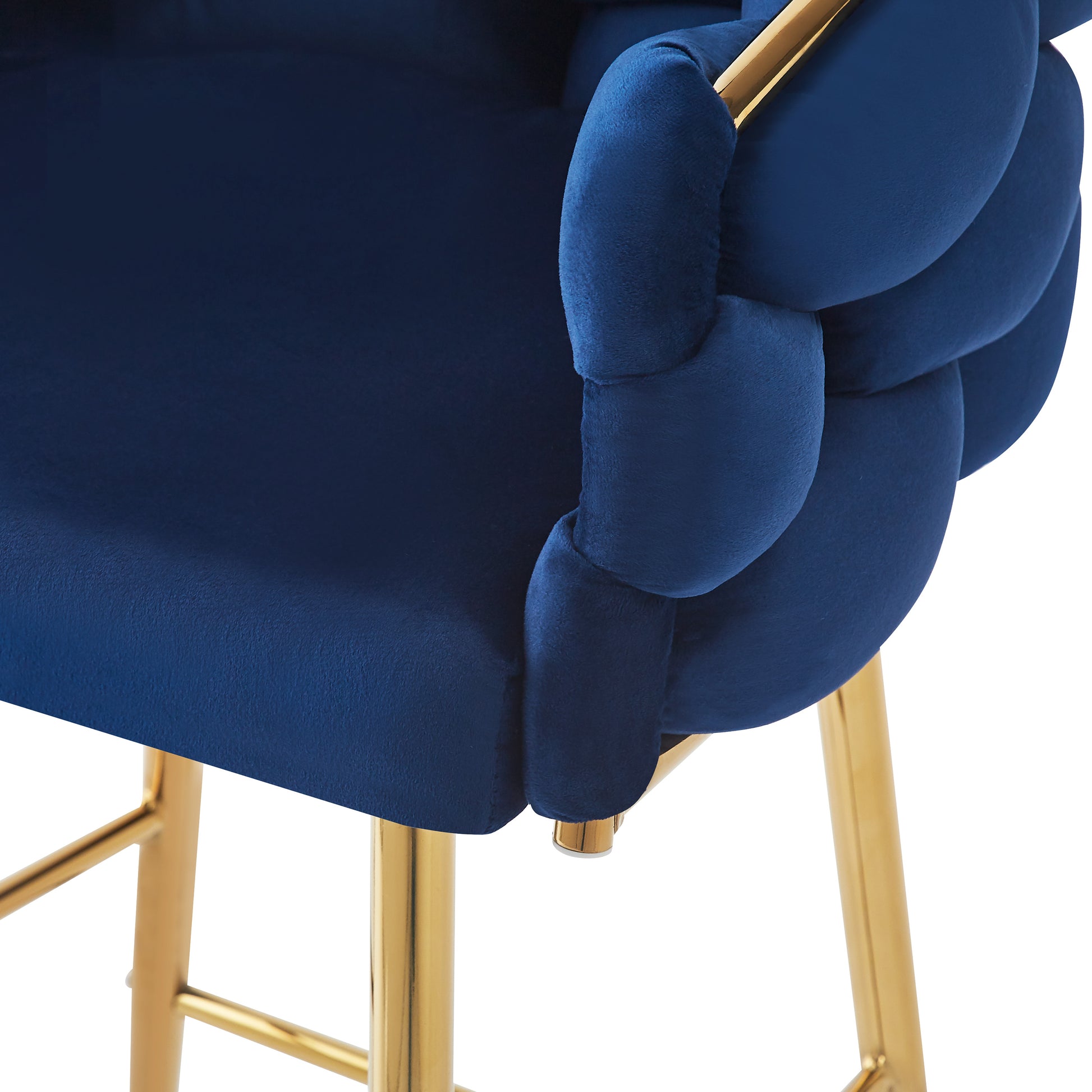 Navy blue velvet armchair with gold legs and braided armrest detail