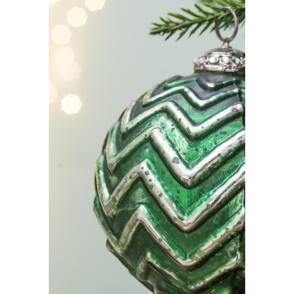 Emerald green glass Christmas ornament with silver chevron pattern