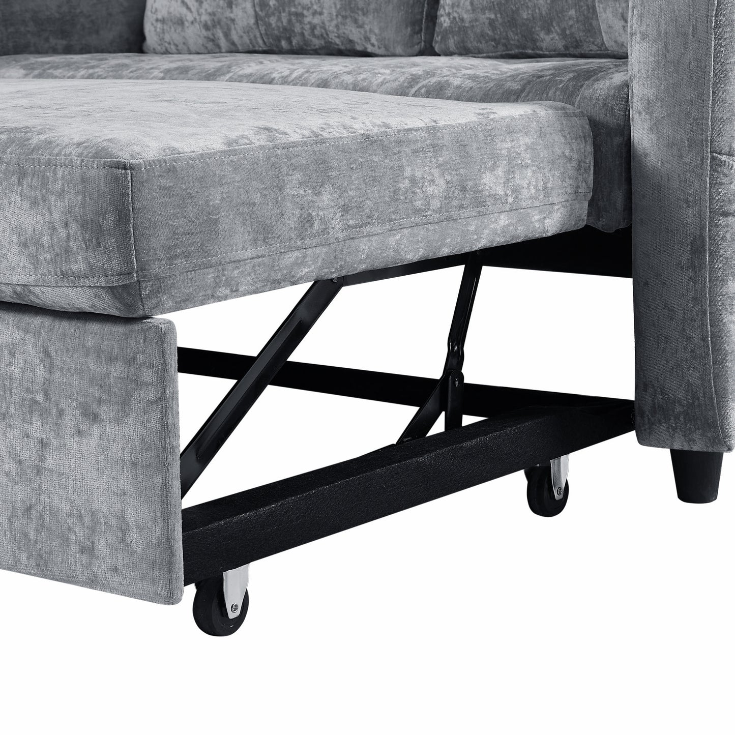 Grey velvet sectional sofa with pullout bed mechanism visible