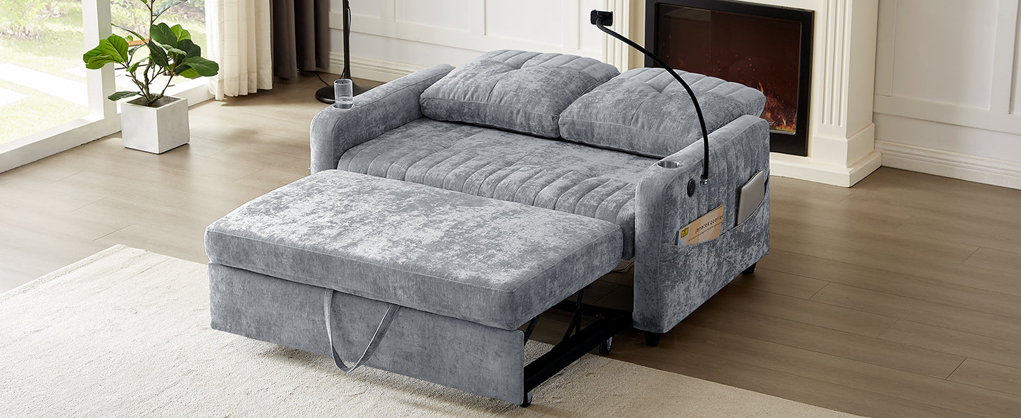 Gray velvet sofa bed with plush cushions and pullout ottoman