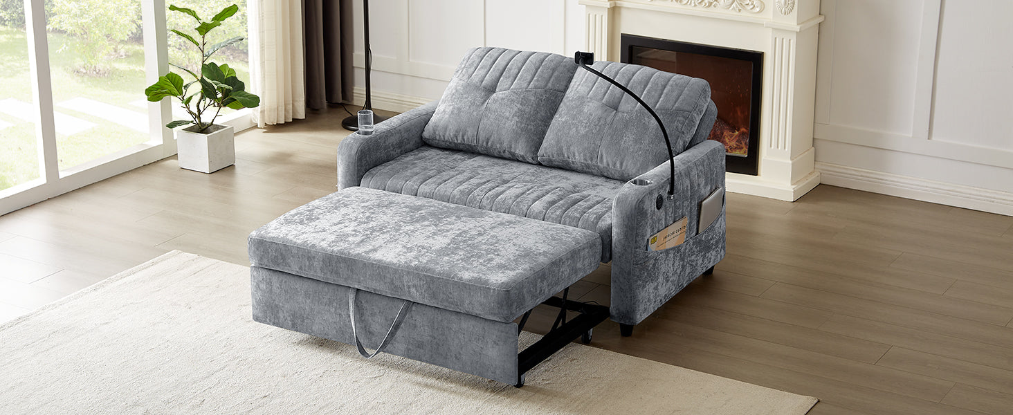 Gray velvet sleeper sofa with pullout ottoman and builtin storage pockets