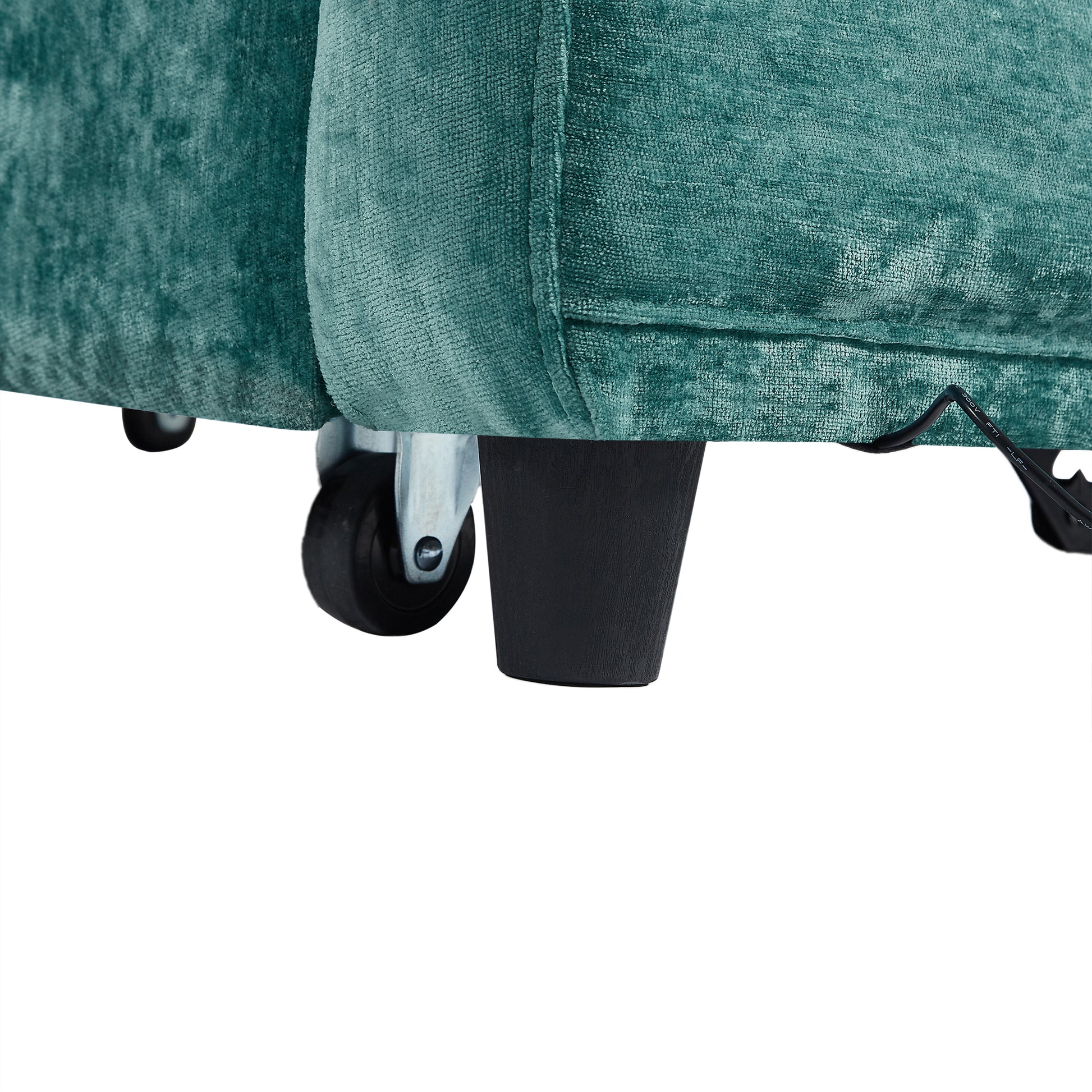 Teal velvet armchair leg with hidden wheels