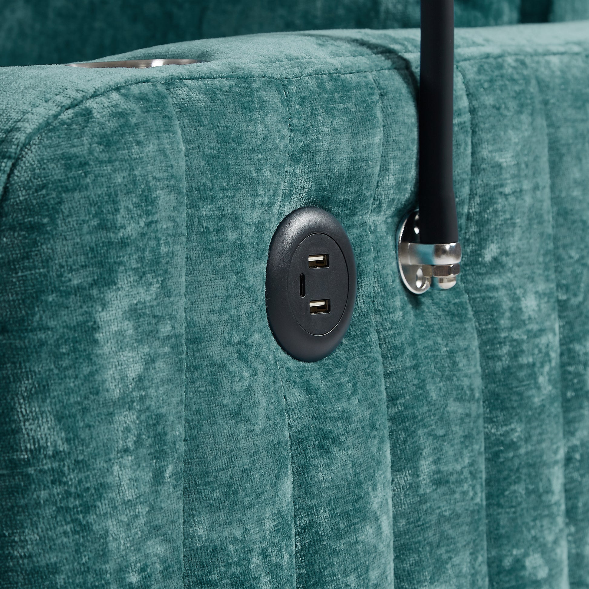 Teal velvet tufted sofa with integrated USB charging port