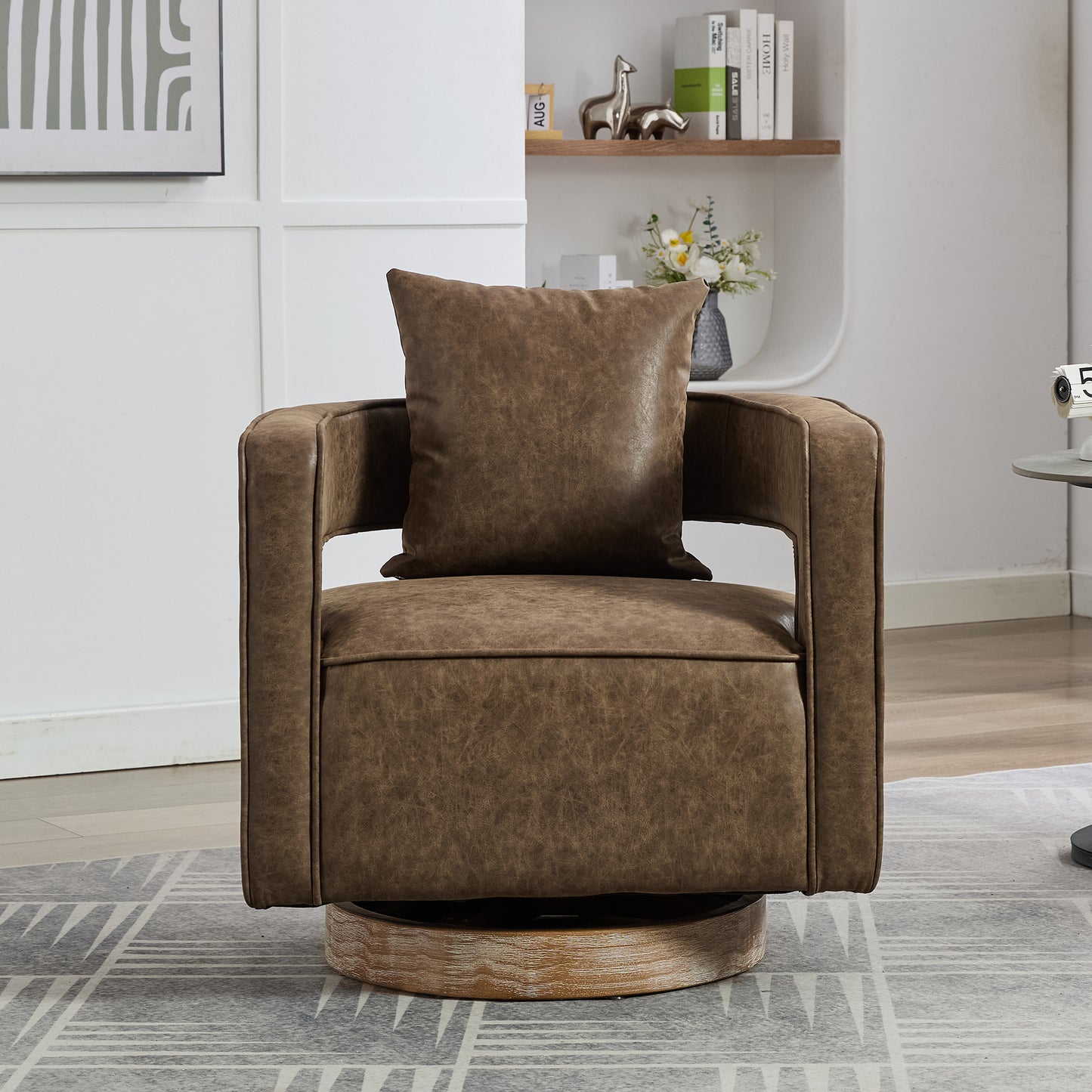 Brown faux leather swivel accent chair with a modern design