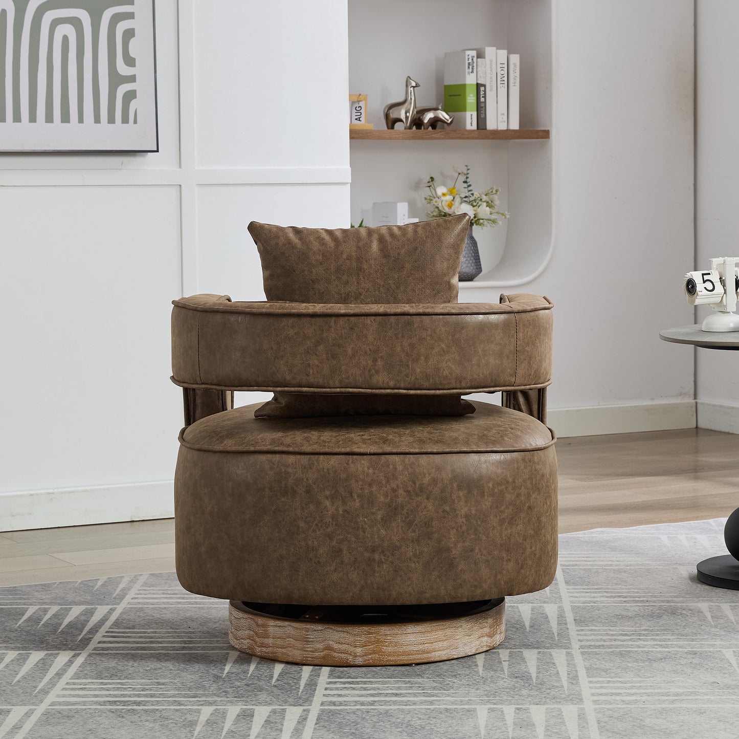 Brown distressed leather swivel accent chair with plush cushions