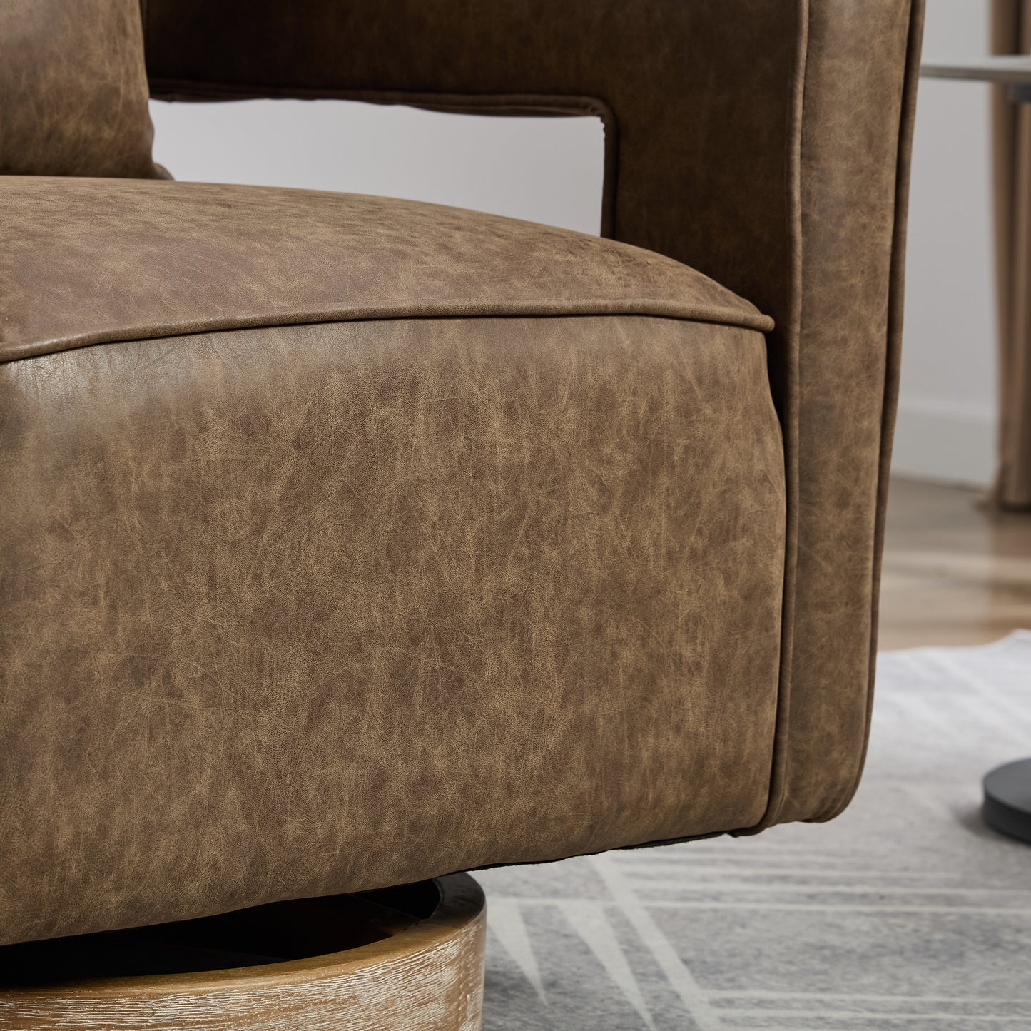 Close up of distressed brown leather swivel chair seat