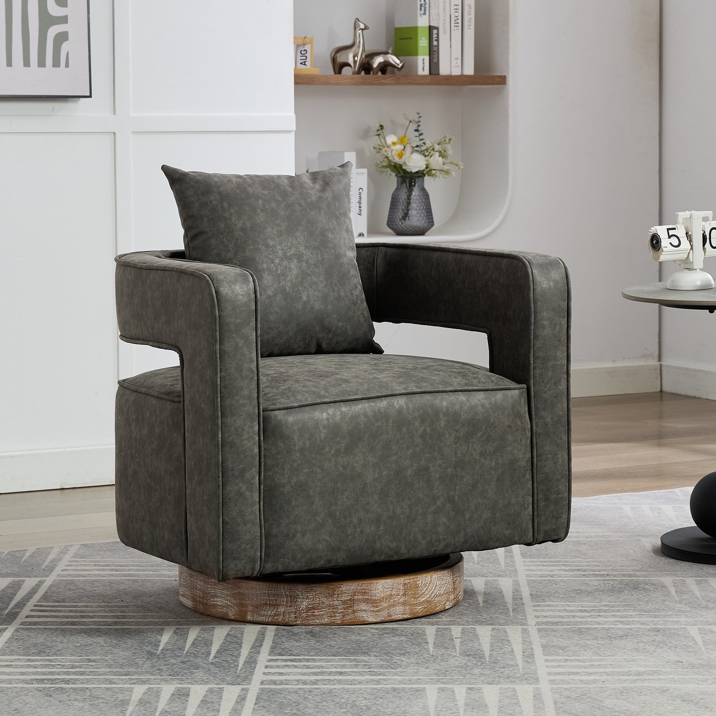 Swivel armchair in distressed grey faux leather with wooden base
