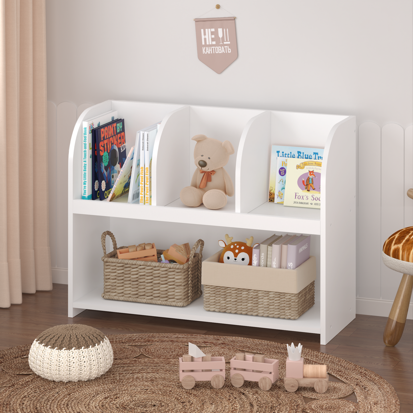 White wooden kids bookshelf with books and toys