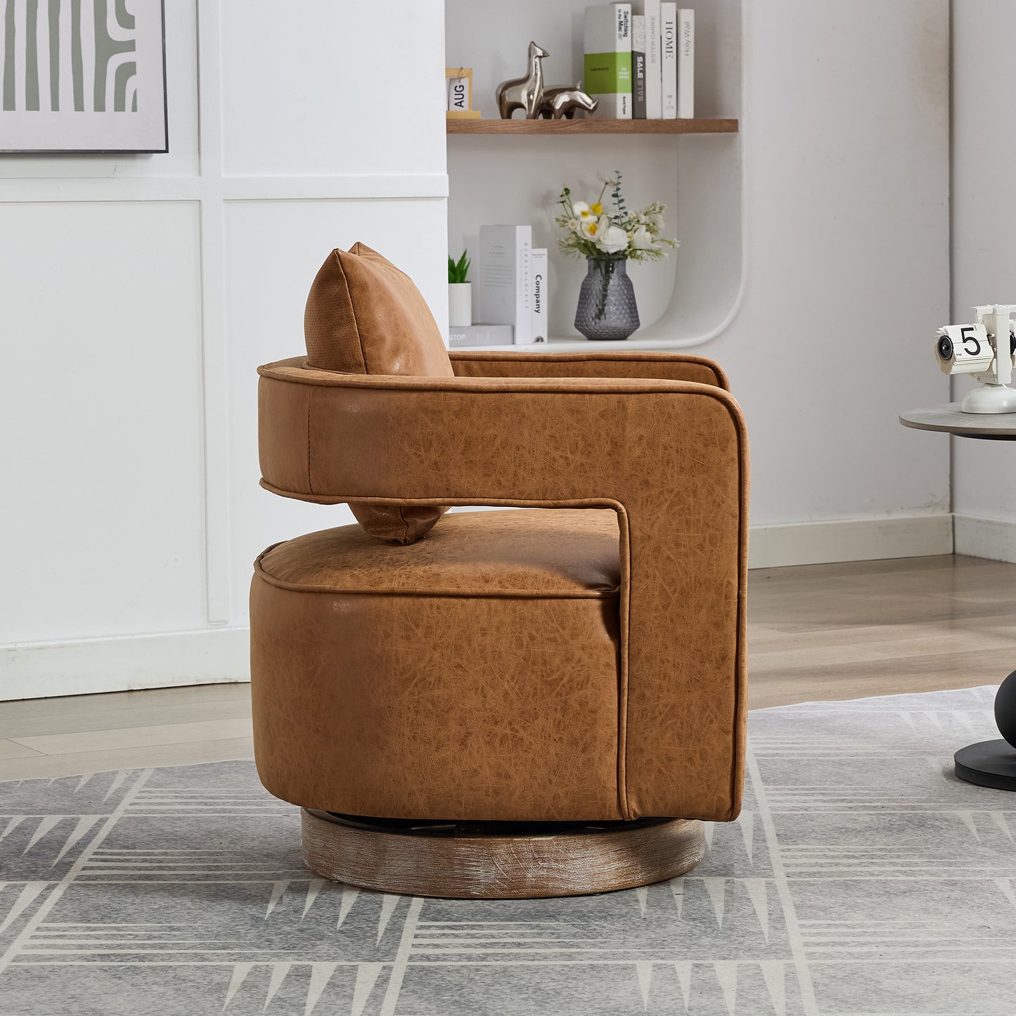 Tan faux leather swivel accent chair with plush cushion