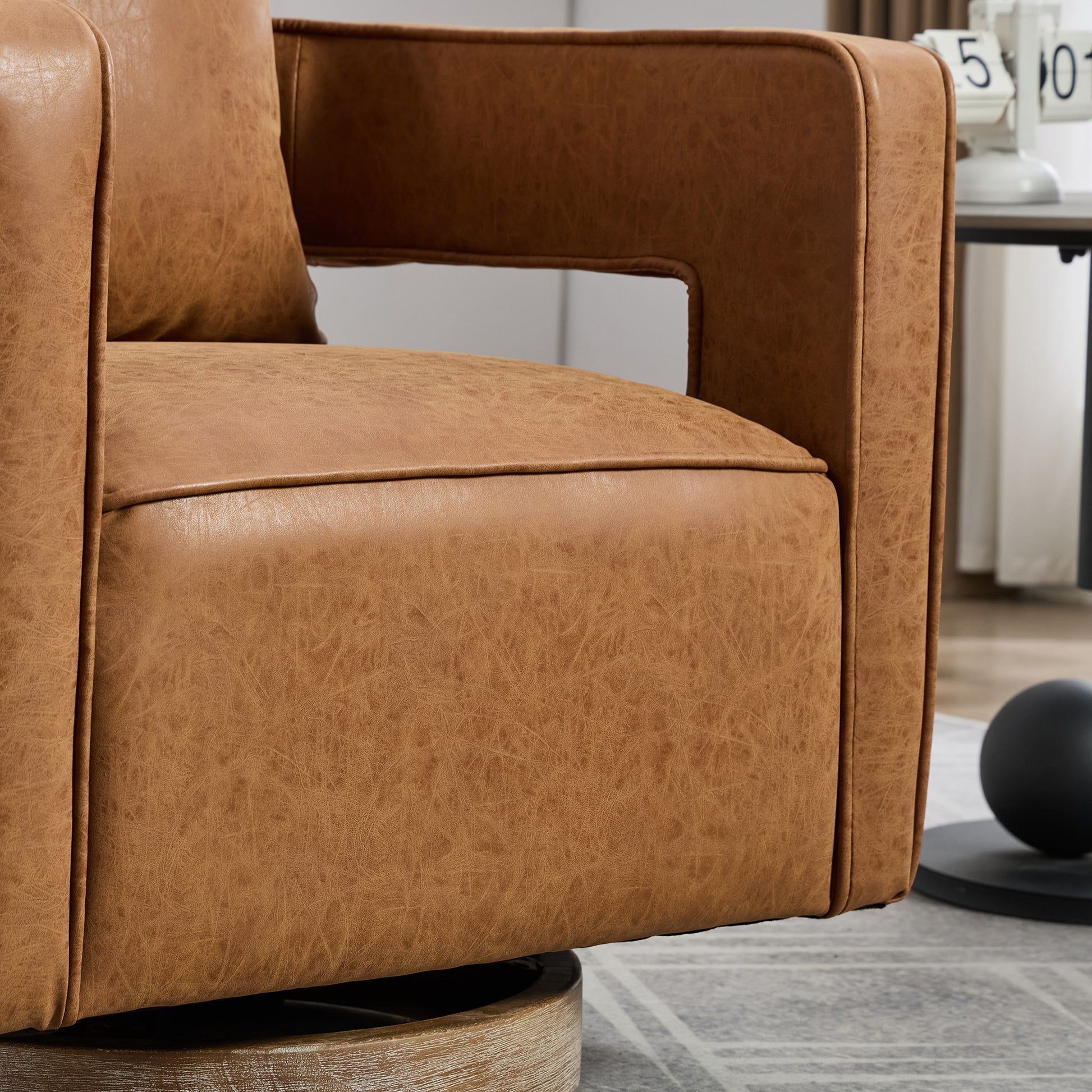 Tan faux leather armchair with plush seat cushion