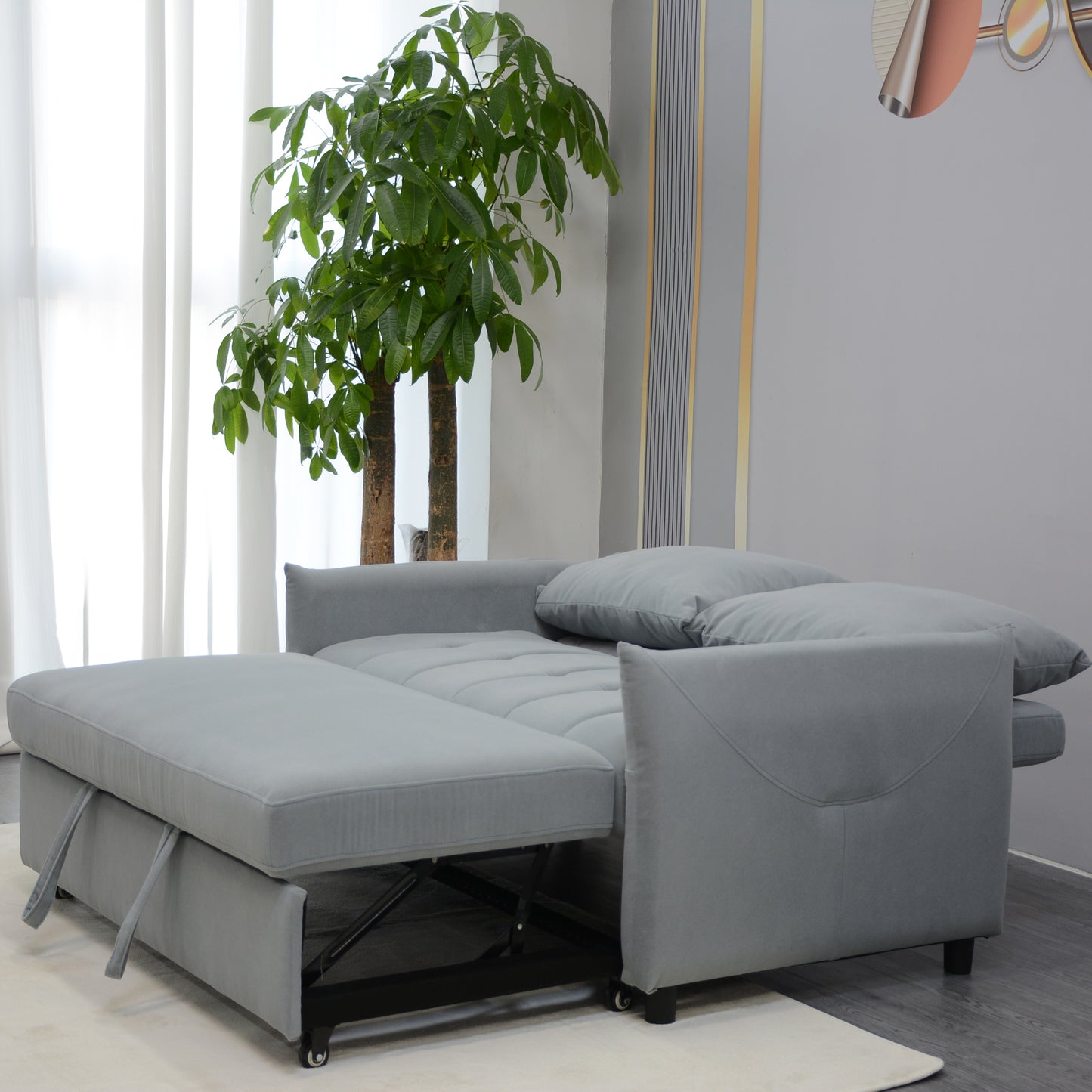 Gray pullout sleeper sofa with plush cushions and hidden wheels
