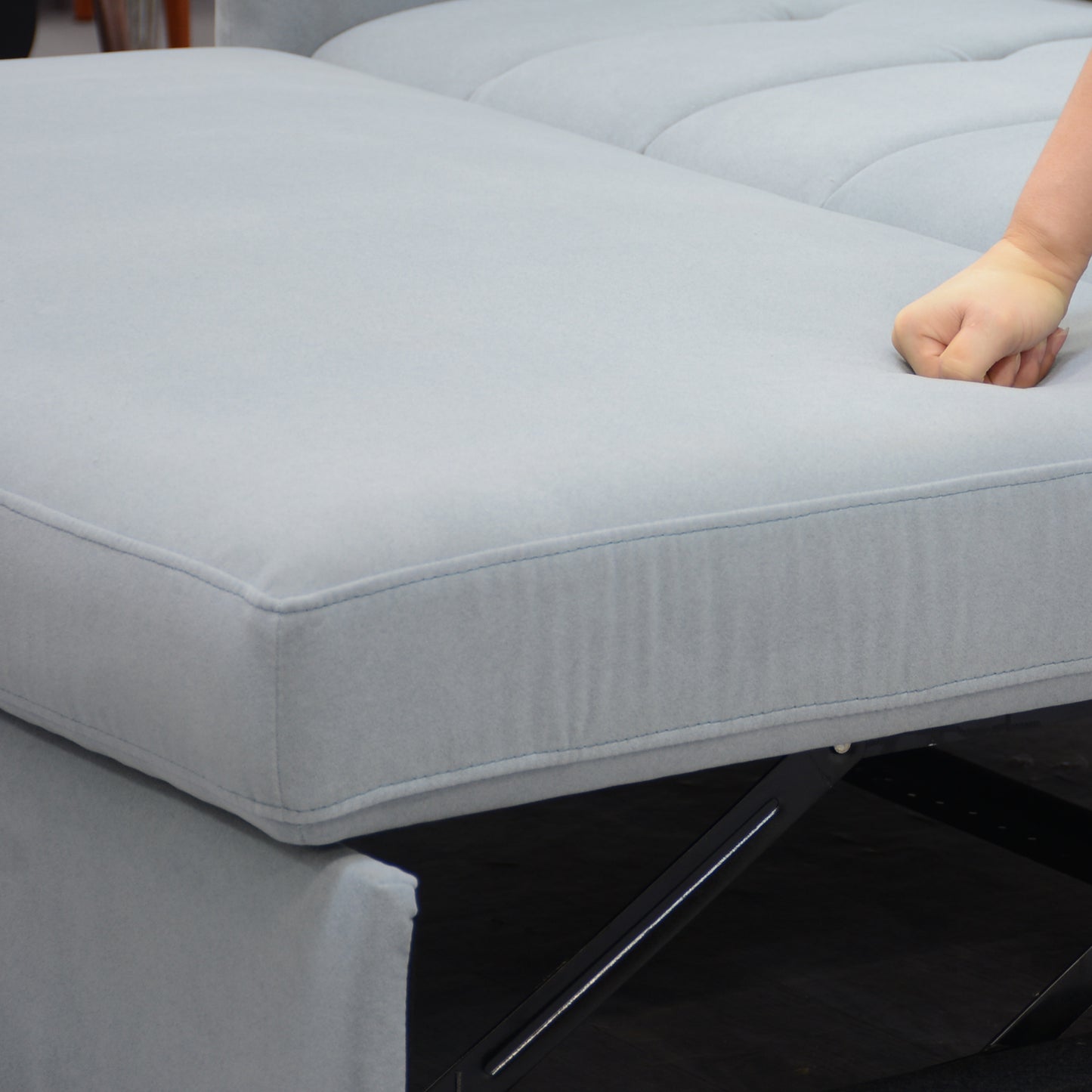Light gray velvet sectional sofa with plush seating