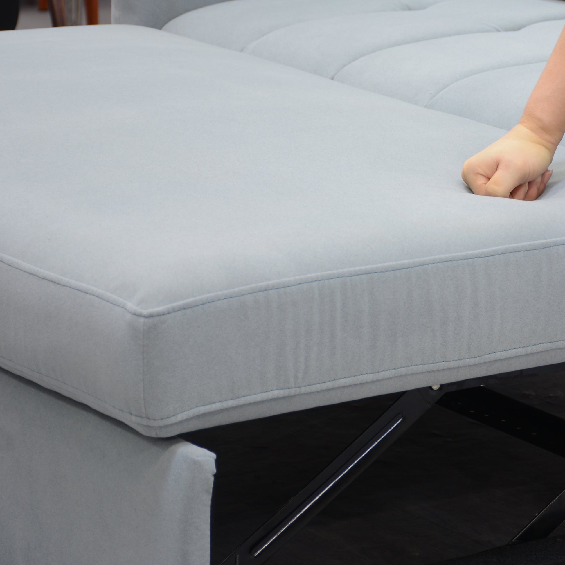 Light gray velvet sectional sofa with plush seating