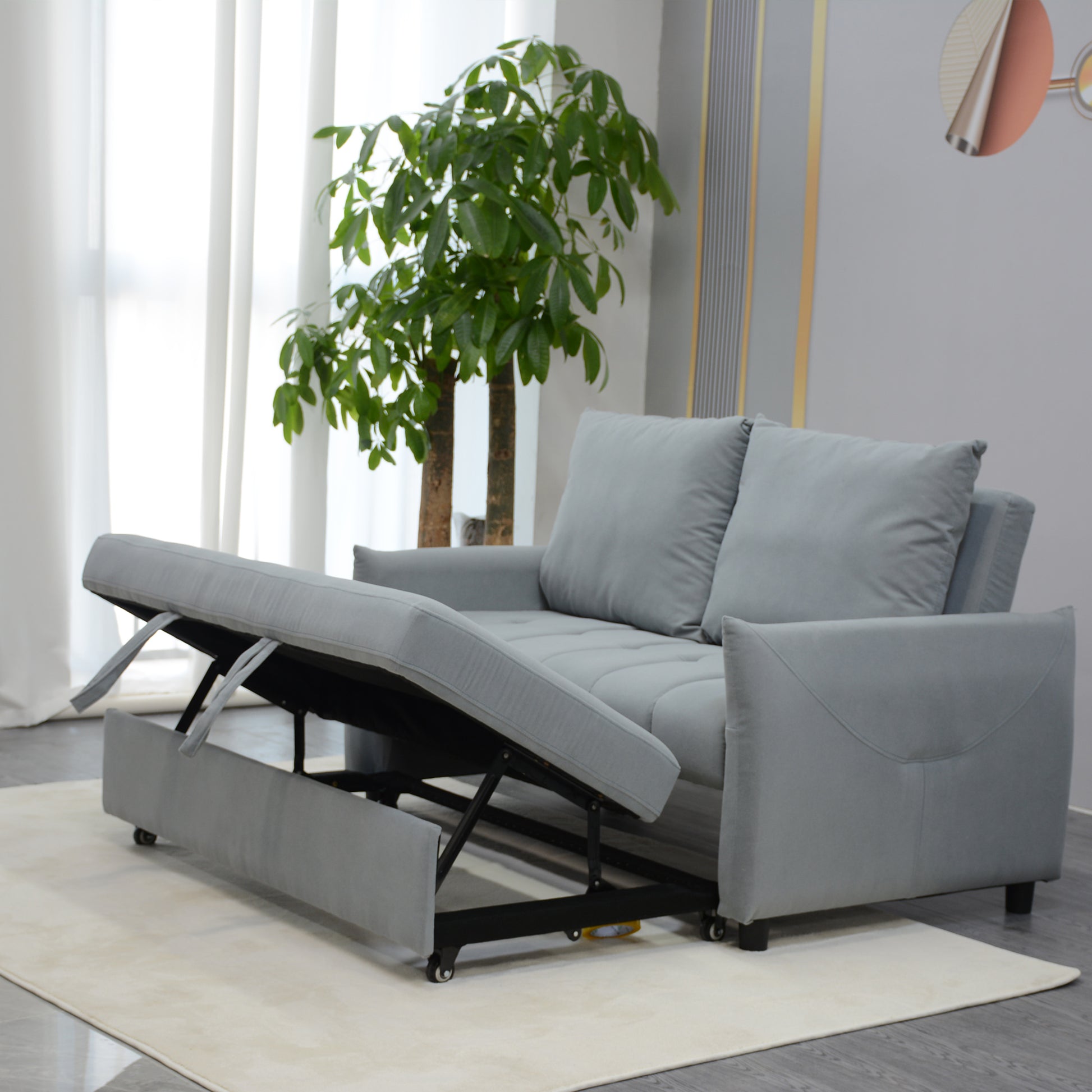 Grey fabric sofa bed with storage compartment