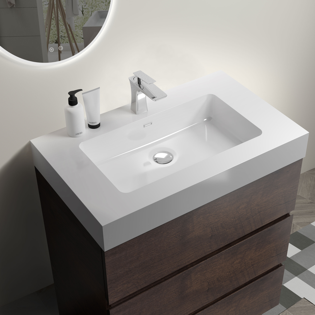 Modern bathroom vanity with white integrated sink and dark wood drawers