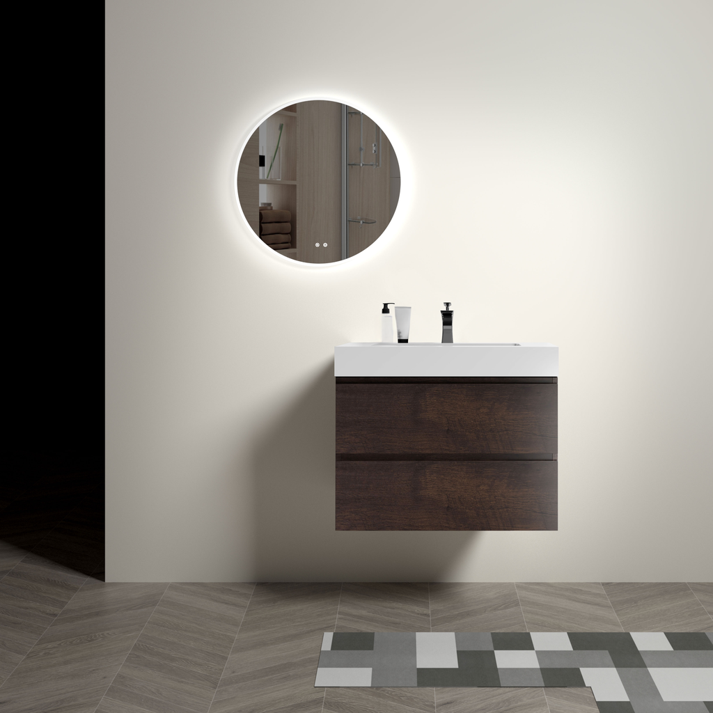 Floating dark wood bathroom vanity with integrated white sink and illuminated round mirror