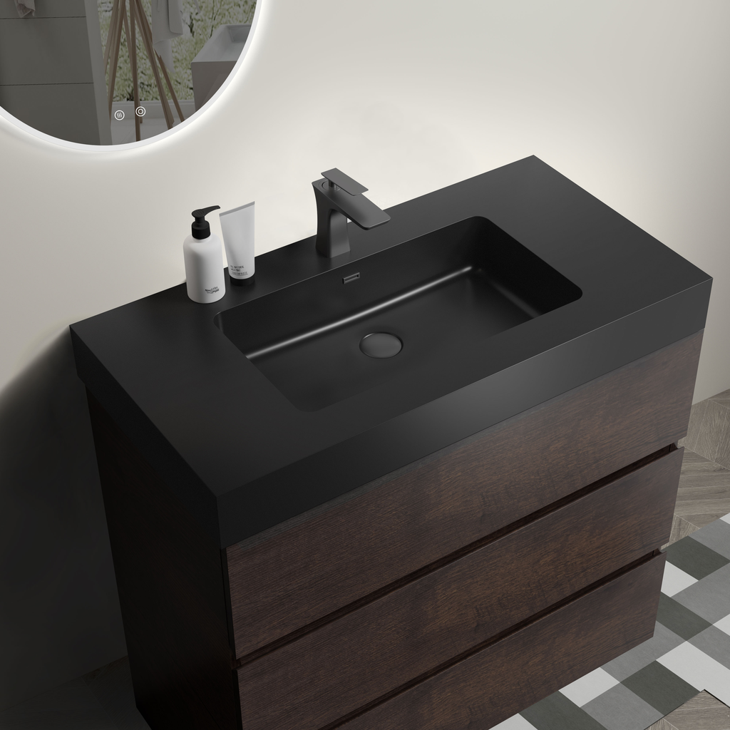 Dark wood vanity with black countertop and integrated sink