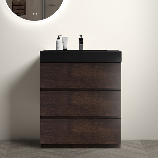 Modern dark wood vanity with black countertop and chrome faucet