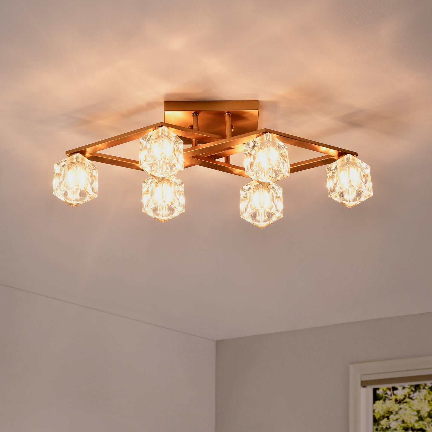 Modern gold flush mount light with geometric accents and crystal cube shades