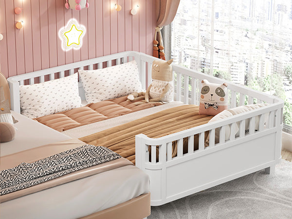 White convertible crib with padded toddler rails and playful bedding