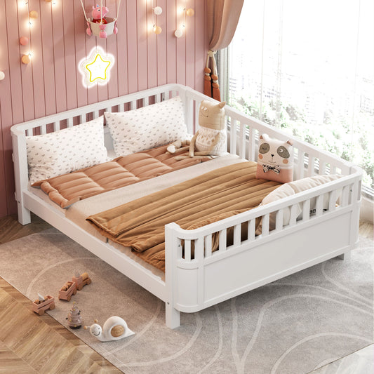 White toddler bed with protective rails and neutral bedding