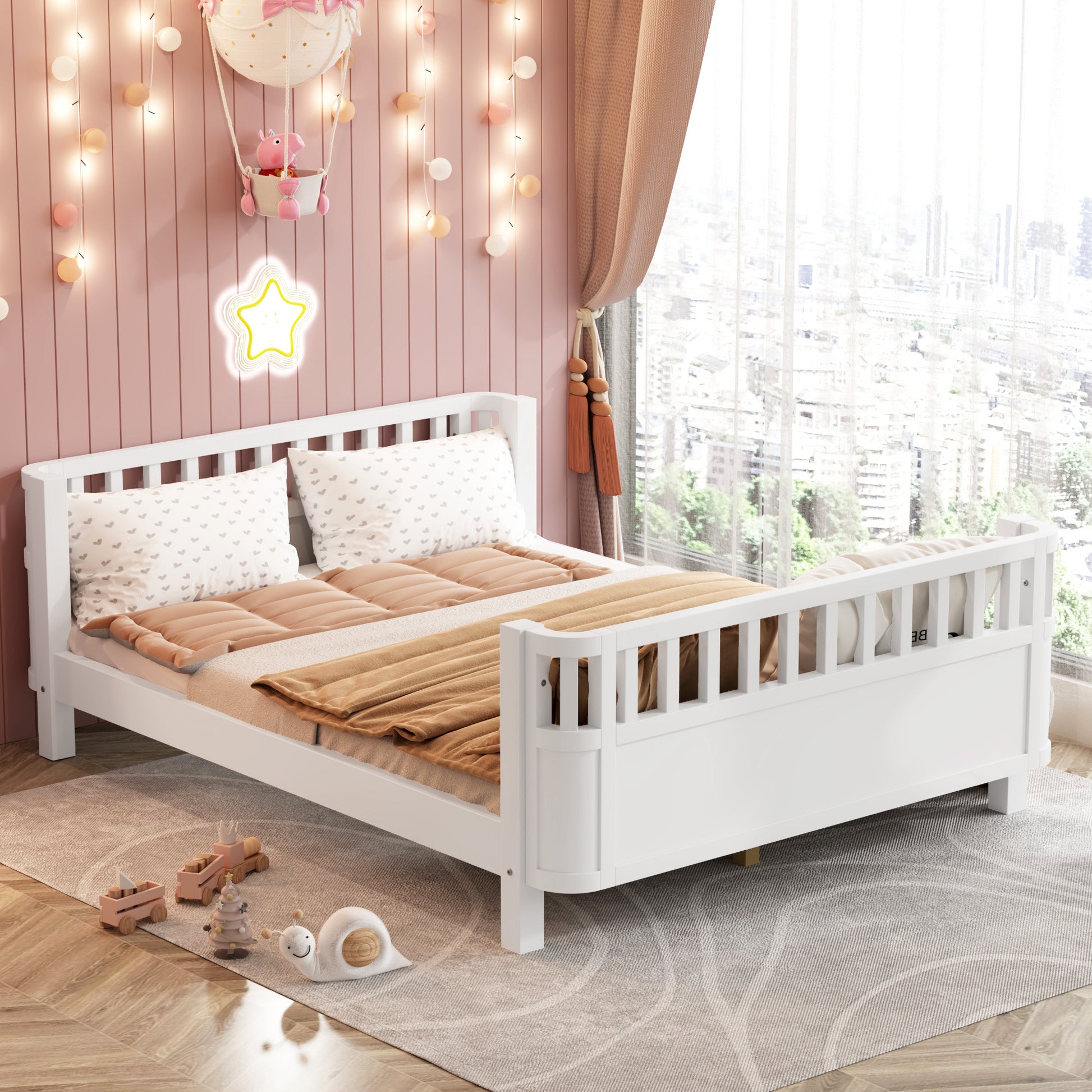 White wooden toddler bed with playful bedding