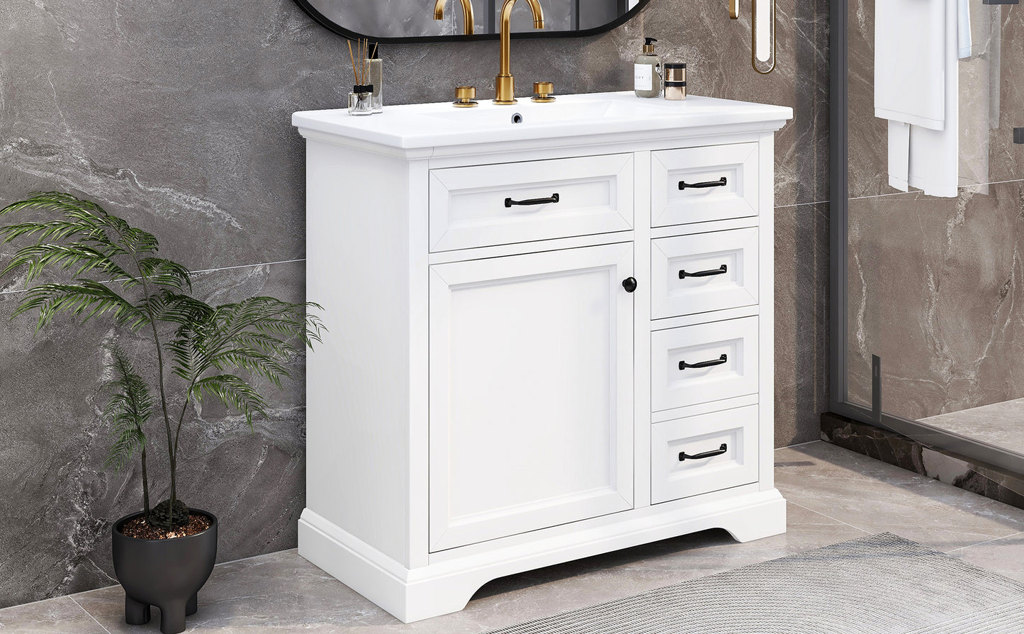 White shaker vanity with gold faucet and black hardware