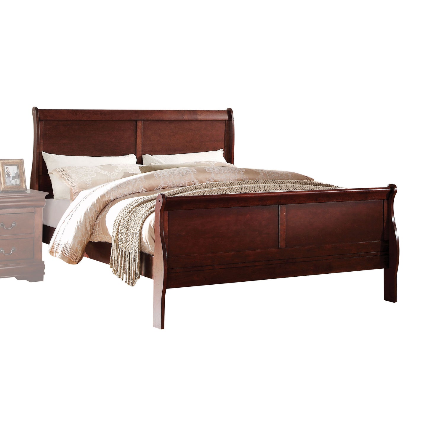 Dark wood sleigh bed with ornate headboard and footboard