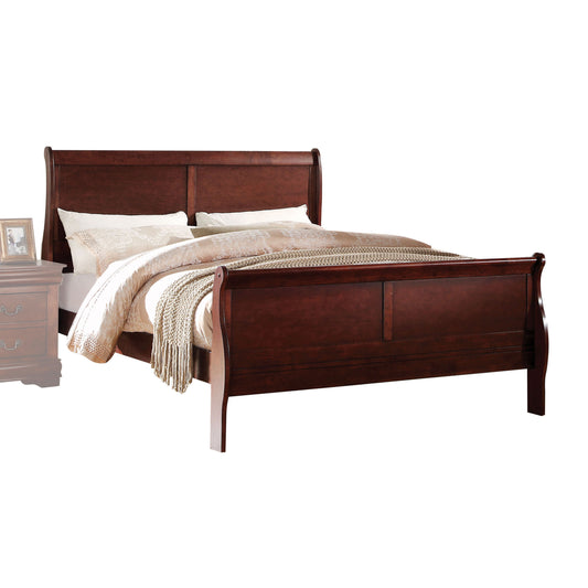 Dark wood sleigh bed with ornate headboard and footboard