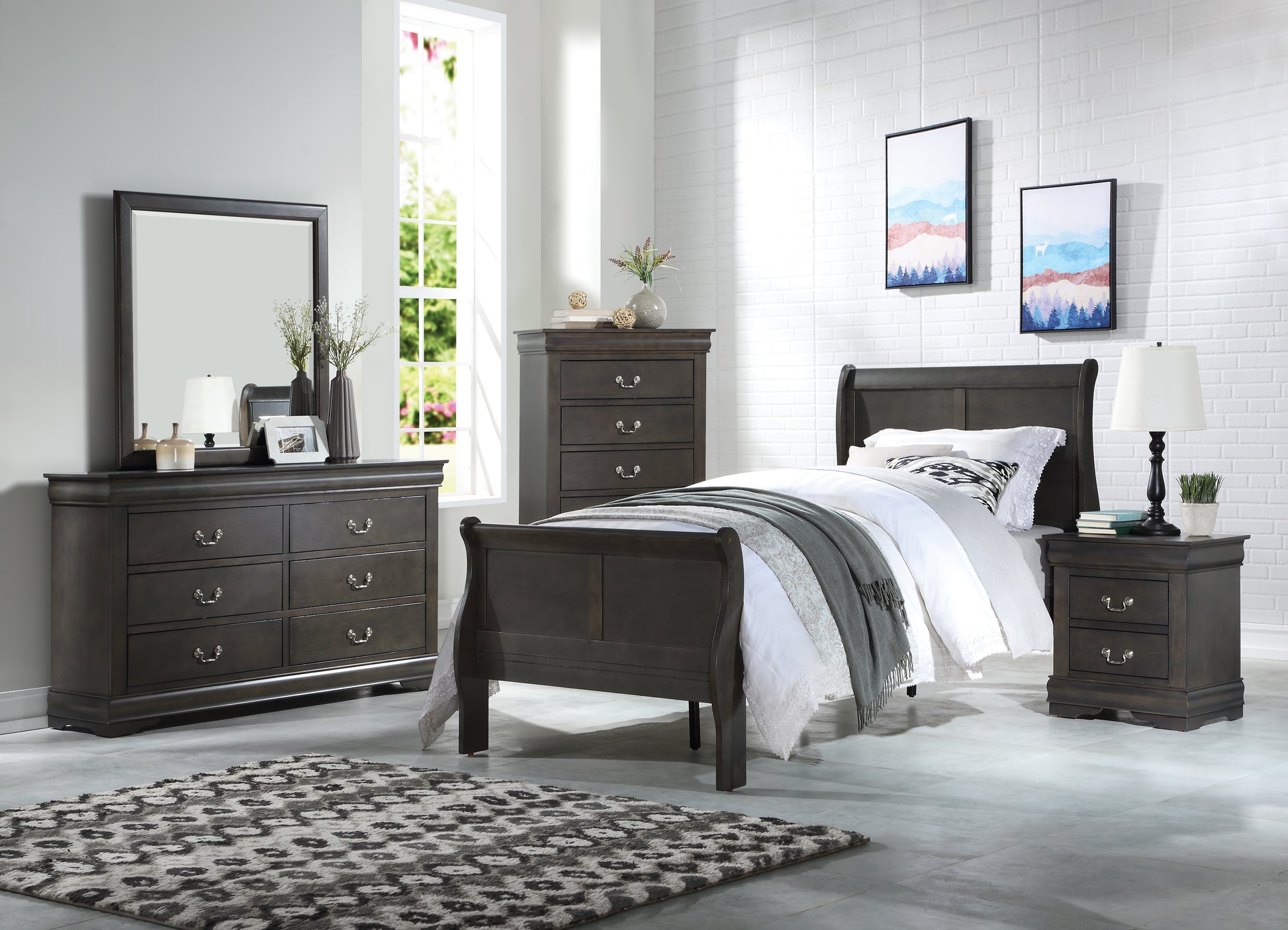 Dark gray sleigh bed with white bedding and a gray throw blanket