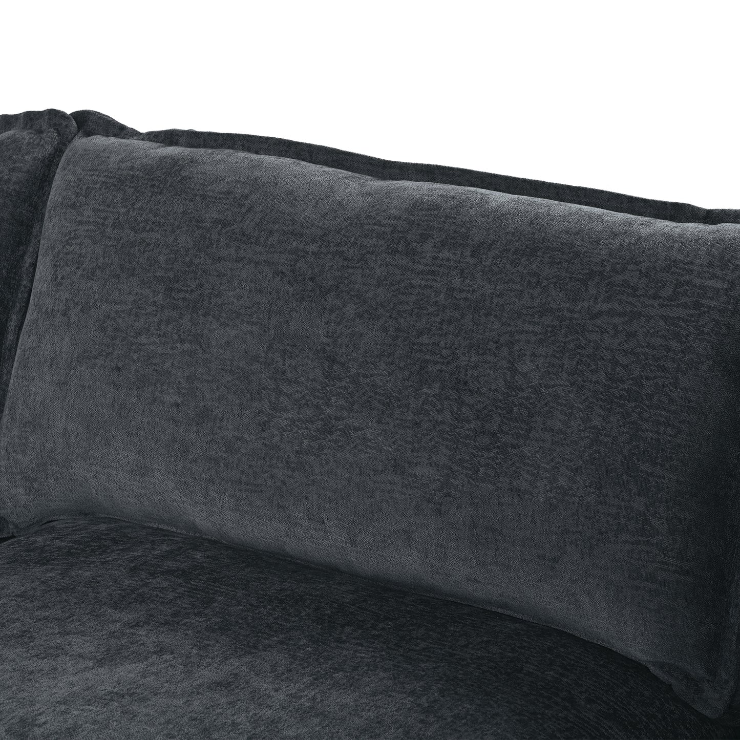 Closeup of a plush charcoal grey velvet sofa cushion