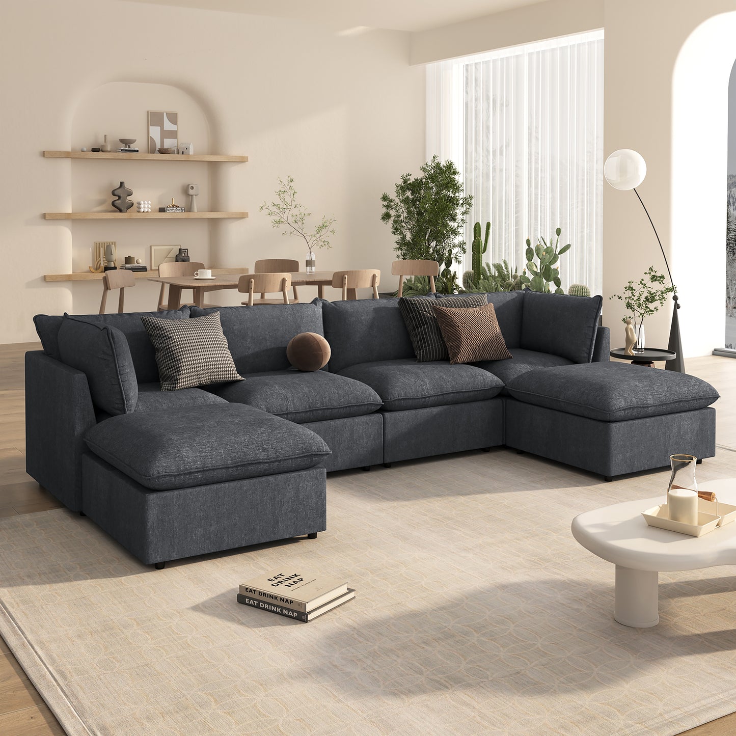 Deep charcoal sectional sofa with plush cushions and accent pillows