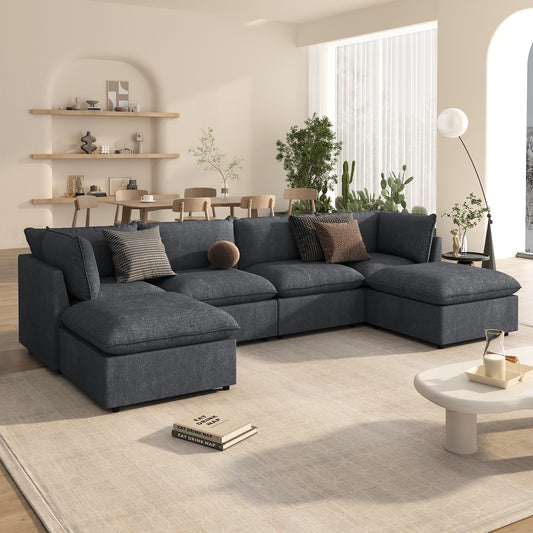 Deep charcoal sectional sofa with plush cushions and accent pillows