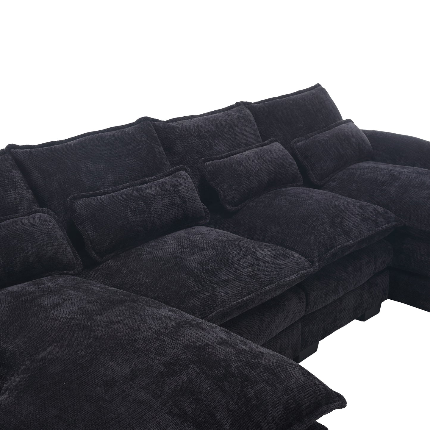 Plush dark gray sectional sofa with deep seating and scatter cushions
