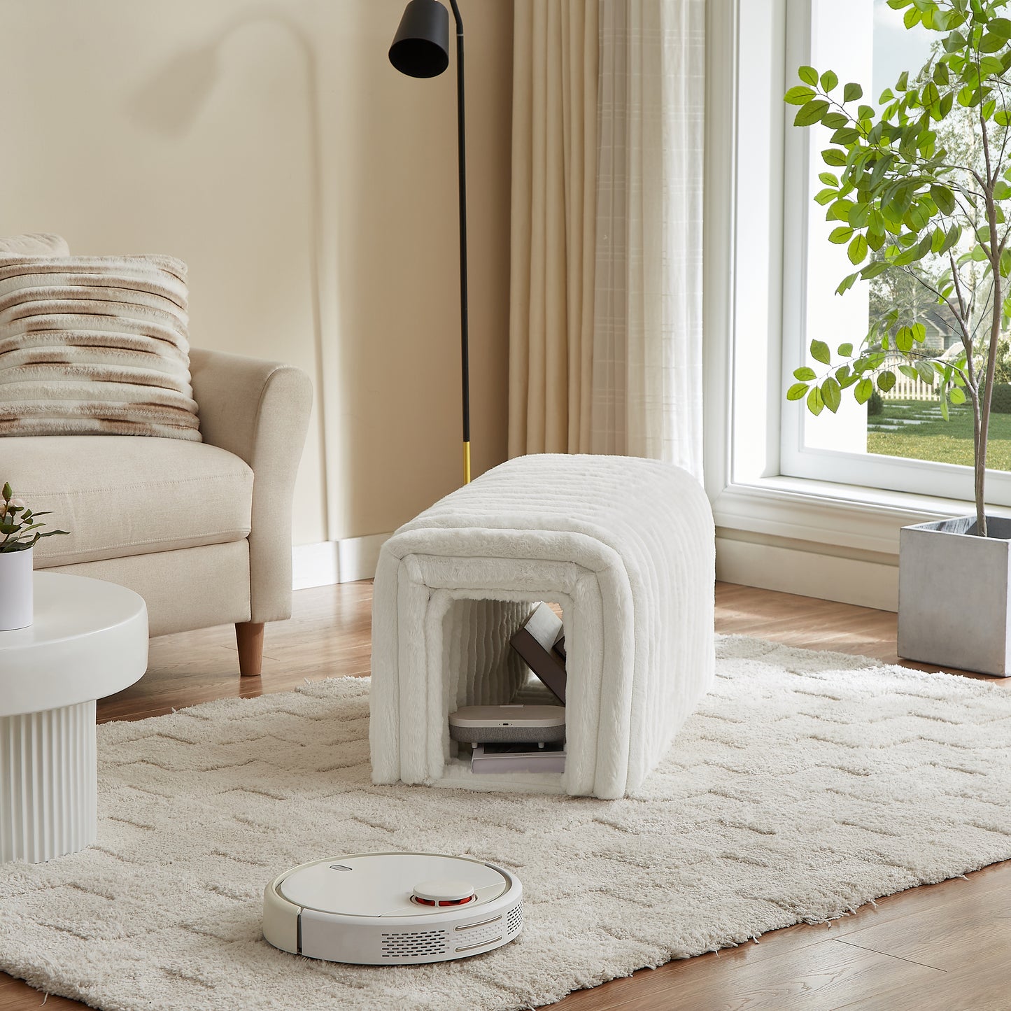 Plush white faux fur ottoman with open storage for a robot vacuum