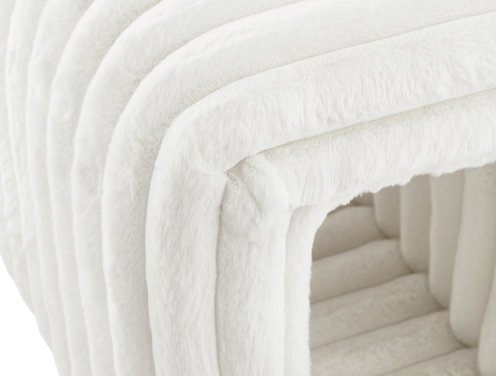Plush white faux fur cube ottoman with ribbed texture