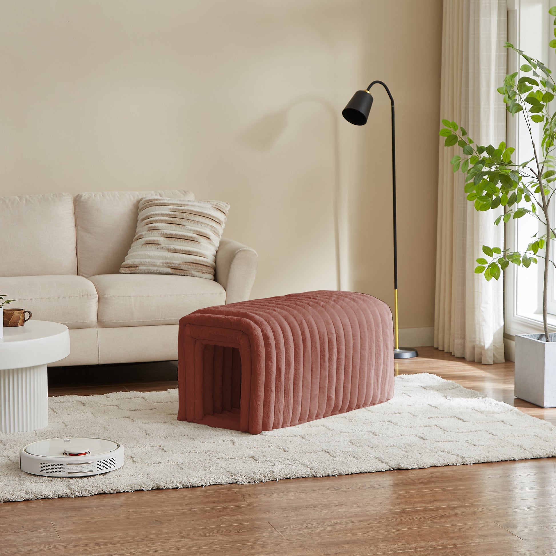 Plush rose gold pet bed with ribbed texture and archway entrance