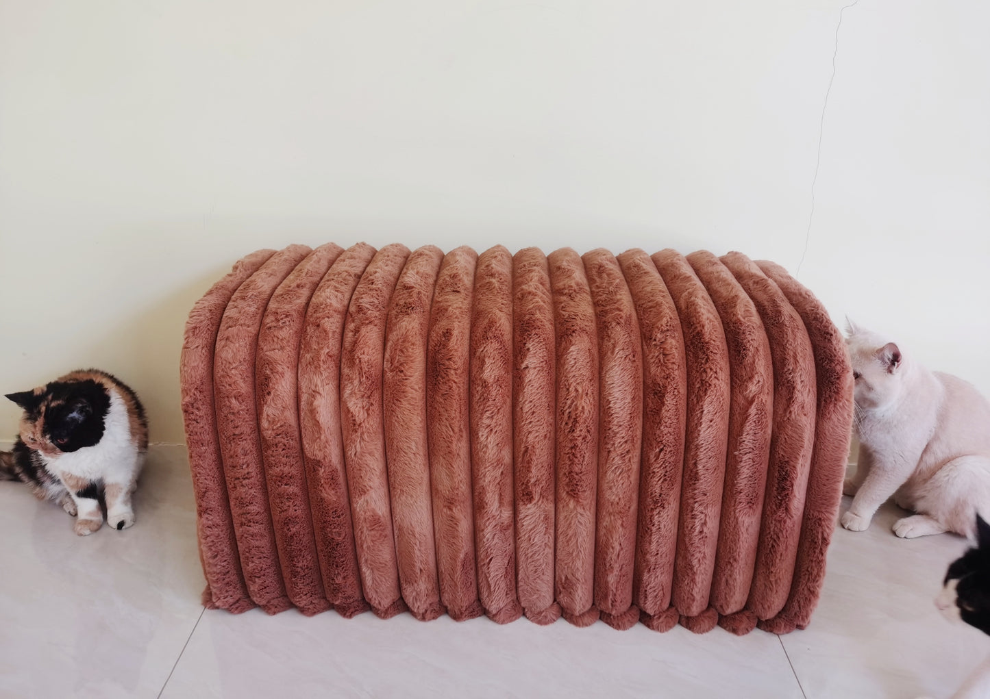 Plush corduroy ottoman in dusty rose