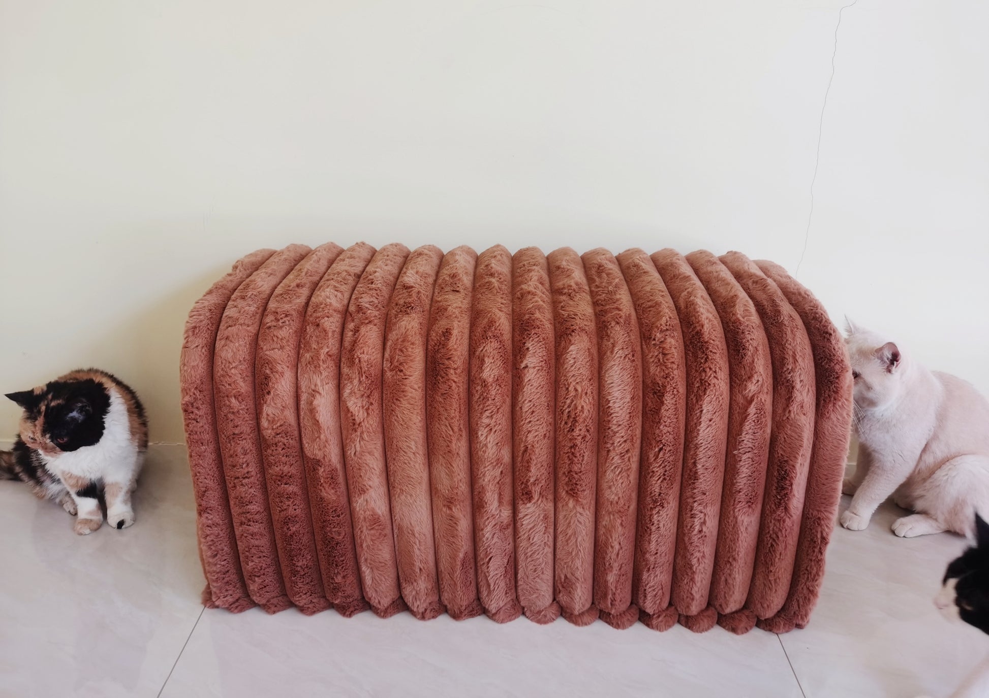 Plush corduroy ottoman in dusty rose