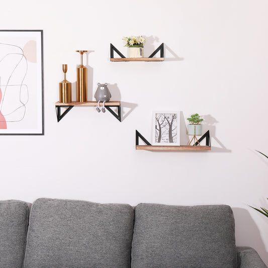 Rustic wooden floating shelf with black metal supports holding decorative items