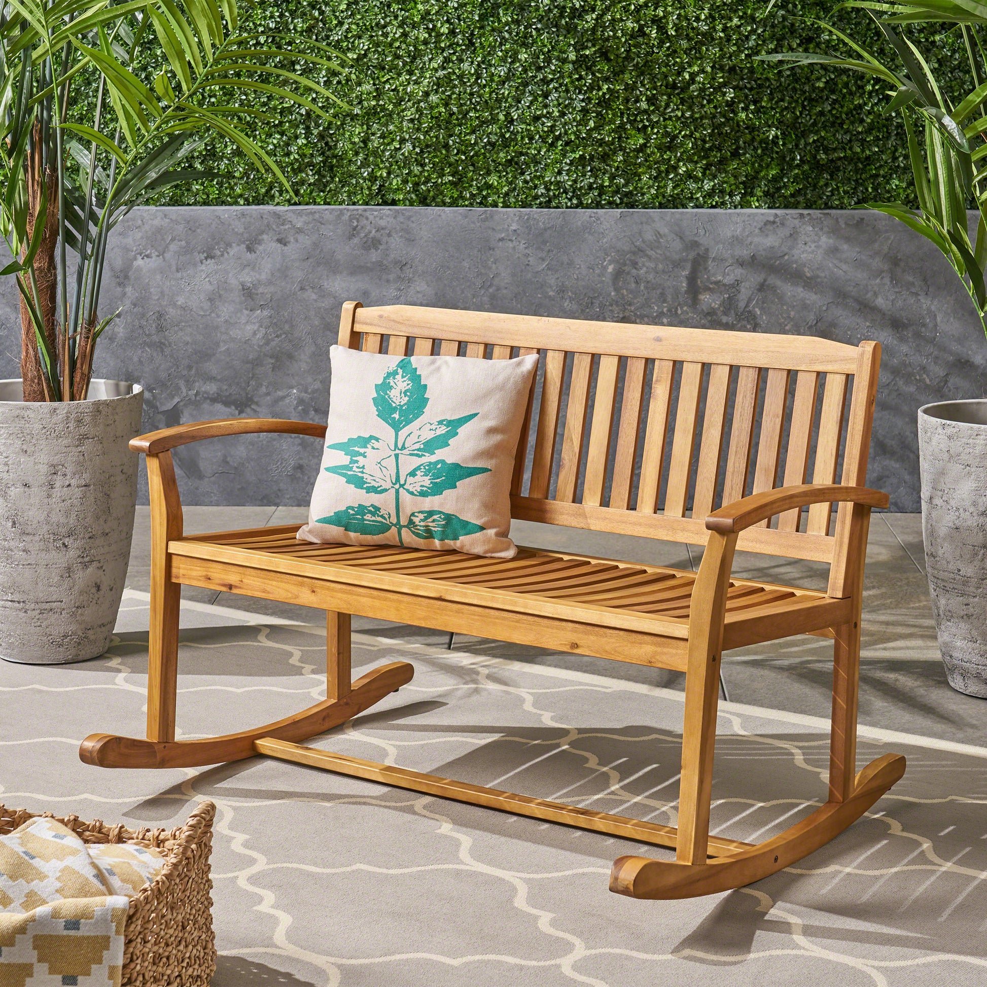 Acacia wood outdoor rocking bench with slatted seat